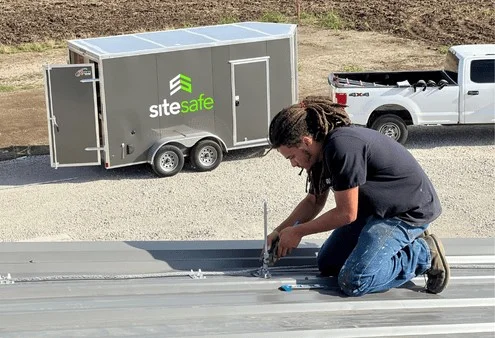 image of a Strike Safe Employee inspection the lightning protection systems on a property