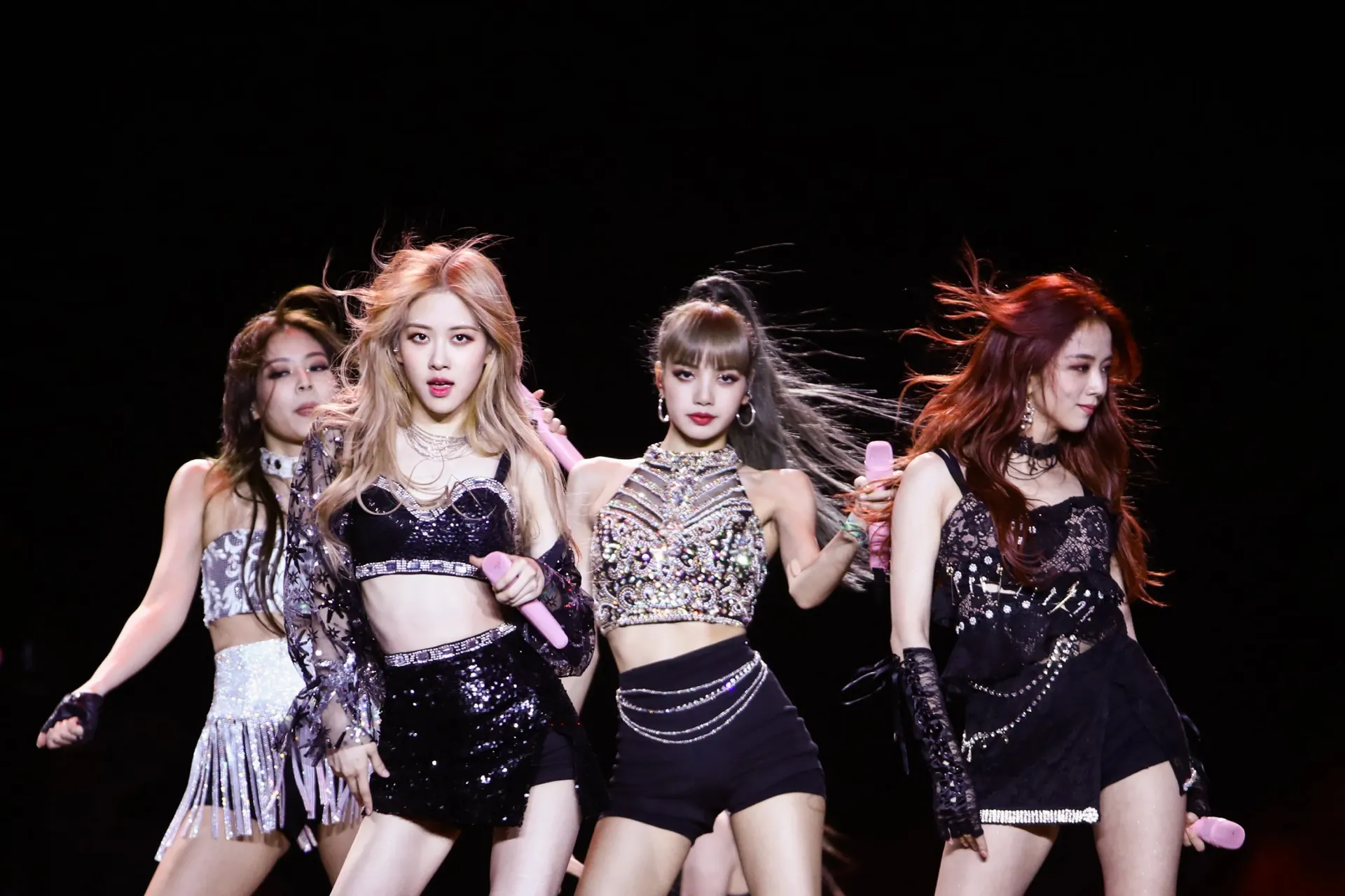 A group of young women standing on top of a stage