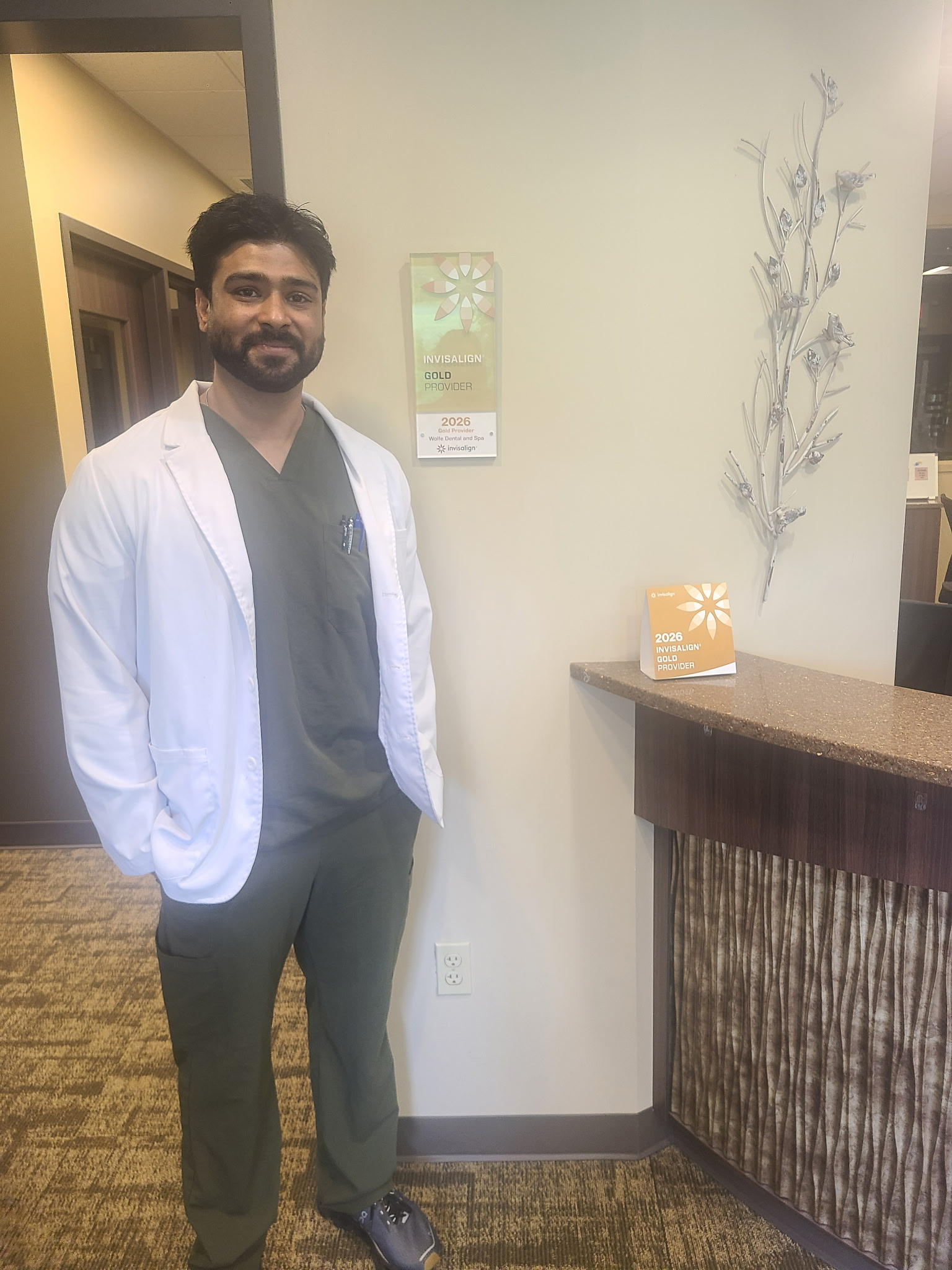 Dr. Mrinal Ganti standing in the Wolfe Dental Spa office
