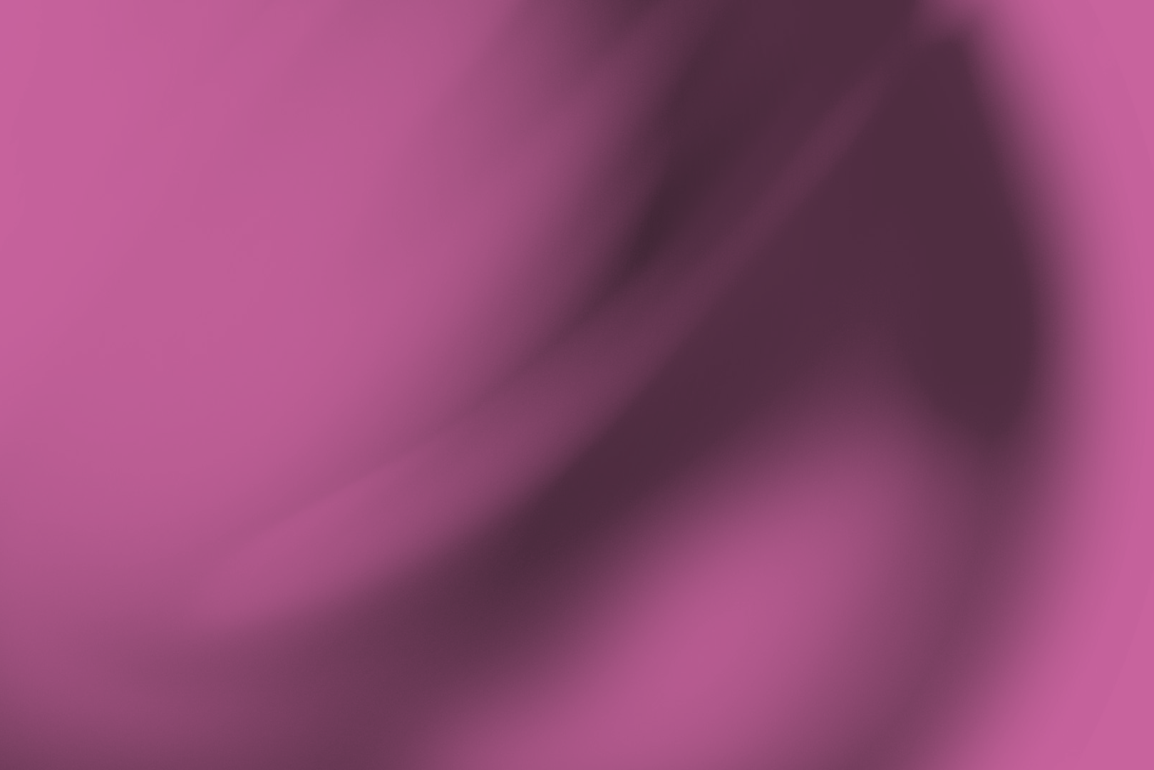 Soft abstract purple and pink blurred gradient background.