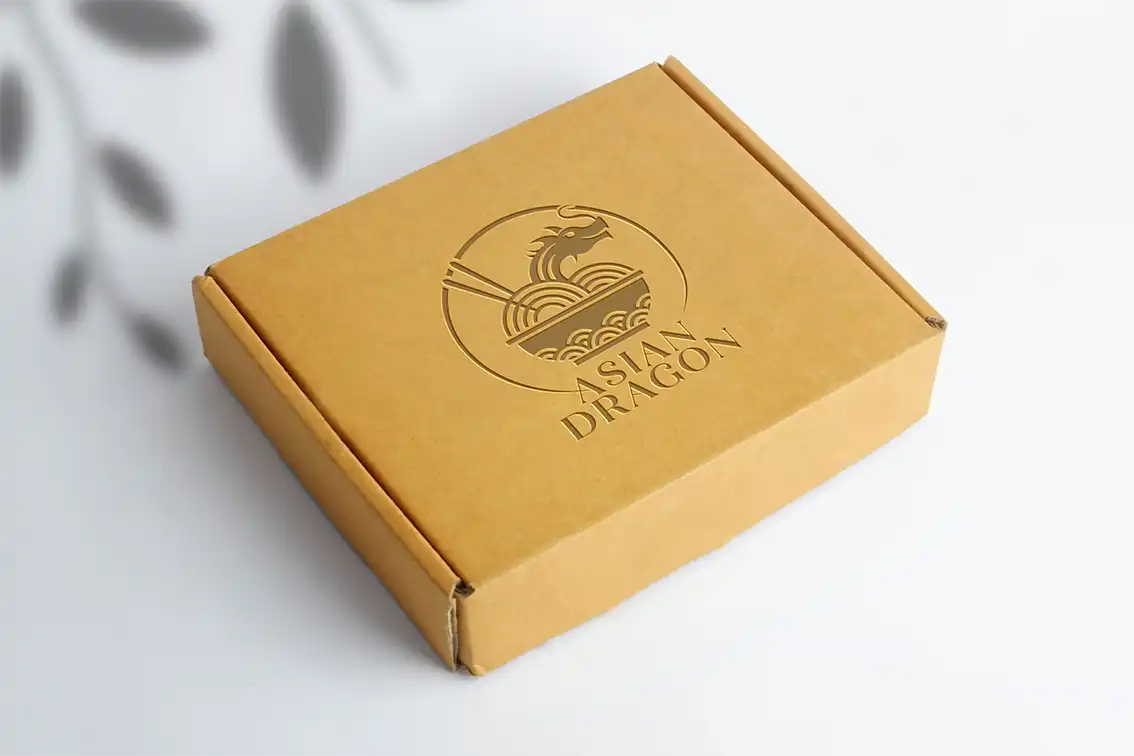 Closed brown cardboard box with embossed Asian Dragon logo