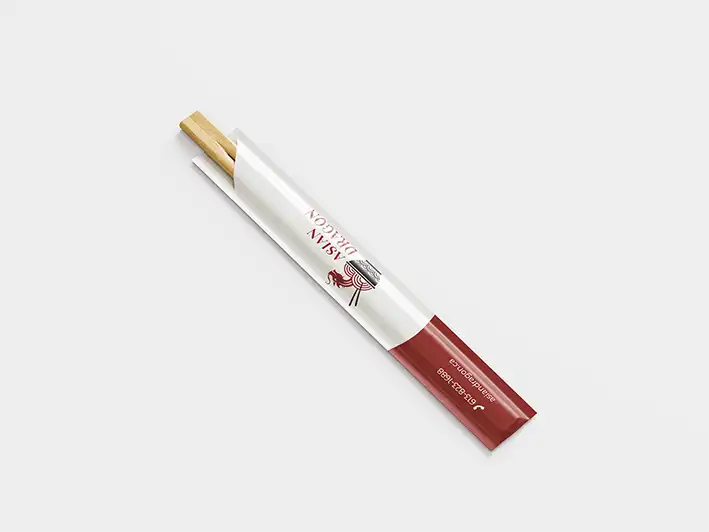 Chopsticks partially wrapped in white and red paper packaging with Asian Dragon logo on a light gray background.