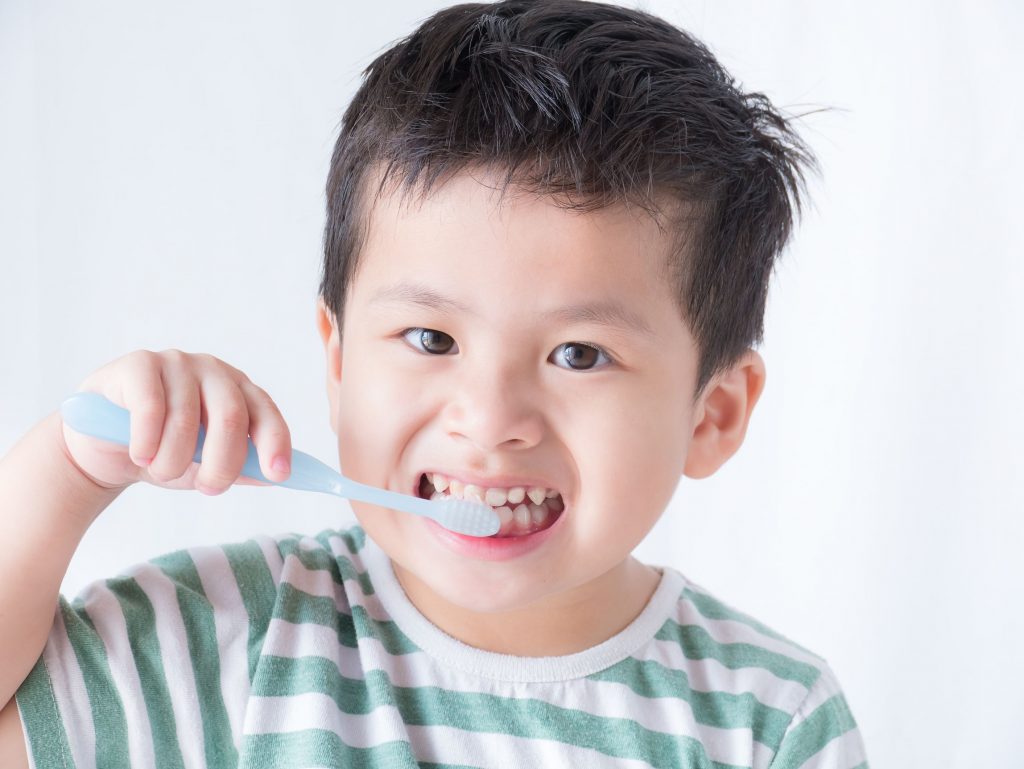 boy kid brushing teeth
