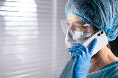 close-up-doctor-talking-phone