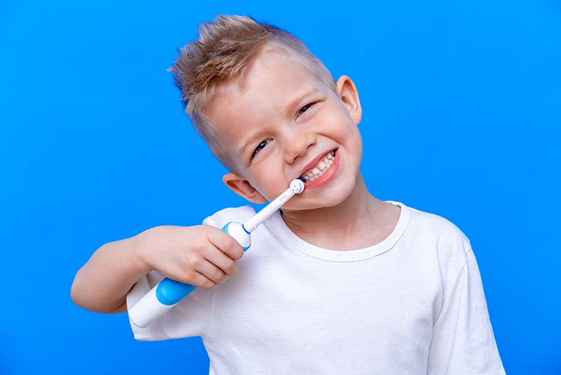 boy-brushing-teeth-with-electric-toothbrush-dental-blog-dental-dost