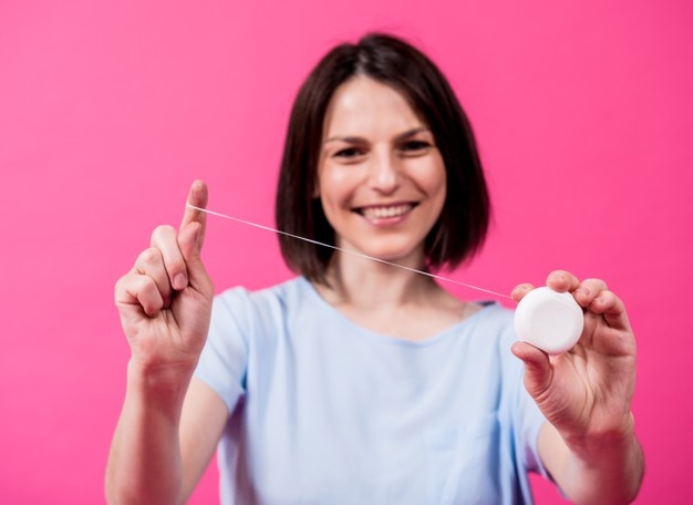 woman-use-vegan-dental-floss