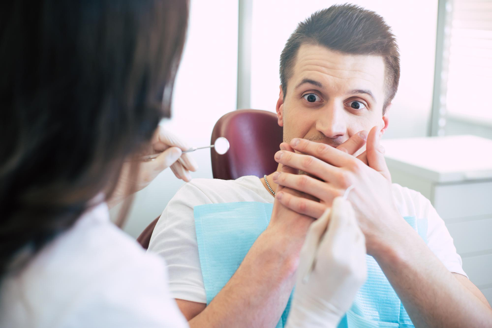 dentist-is-trying-give-treatment-man-she-cant-because-he-is-extremely-scared-shows-it-with-his-hands-his-mouth-look-instruments