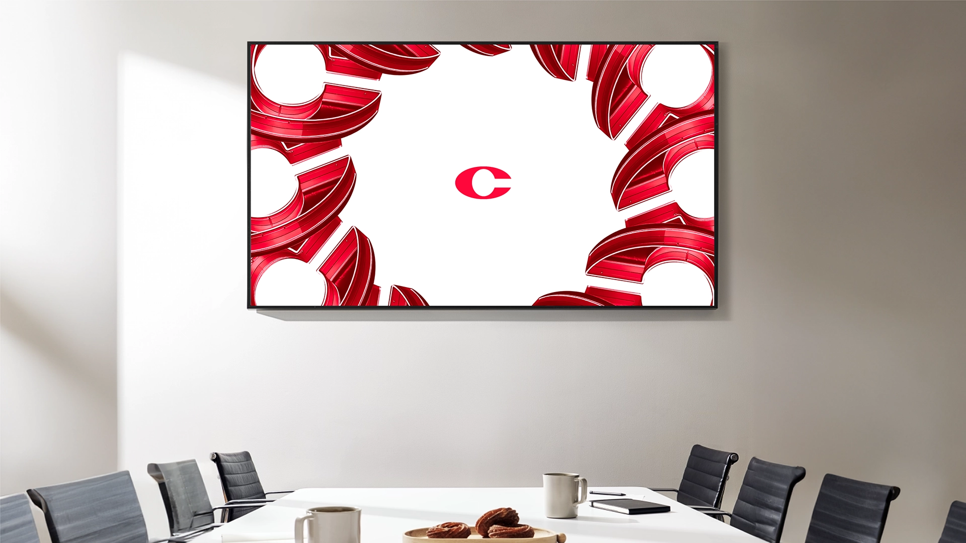 Visual di brand per Campidonico Energy: monitor con pattern grafico rosso e logo a forma di C al centro, parte del nuovo linguaggio visivo studiato da Digistart.