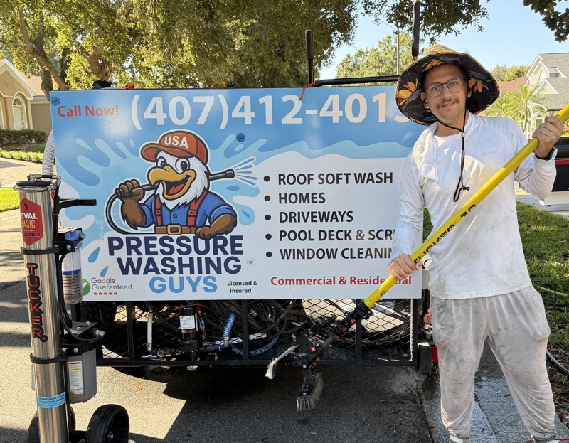Peter posing by his pressure washing truck - Pressure Washing Guys