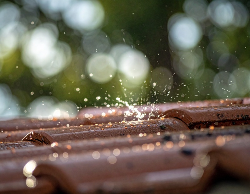 a roof with rain washing down it