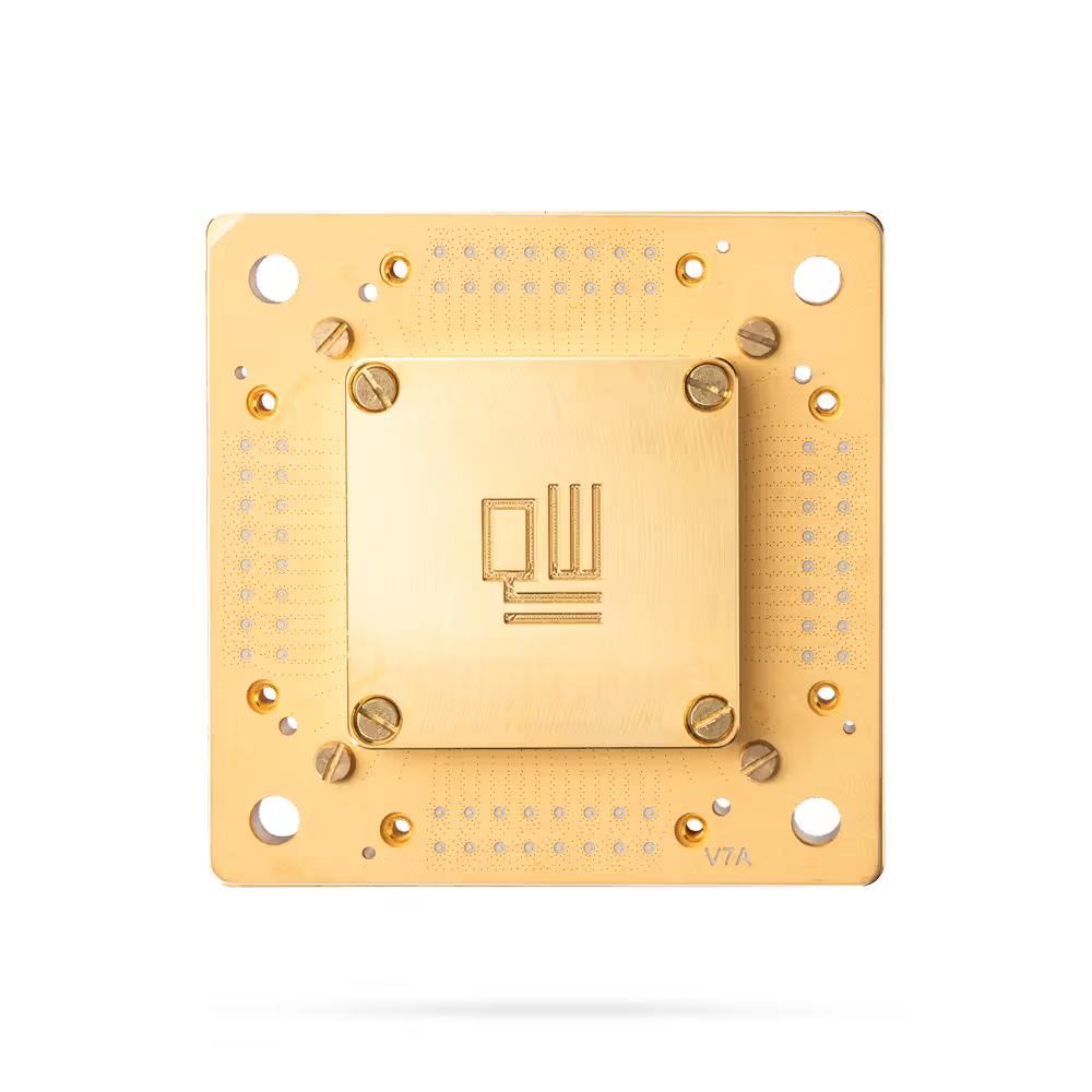 Golden square microchip with intricate circuit details and screws on a black background.
