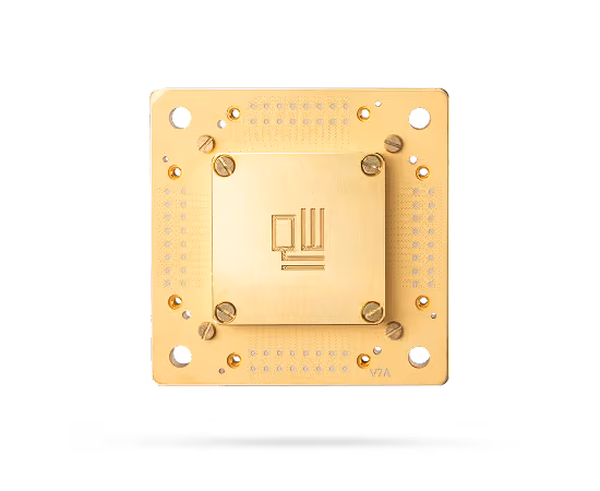 Golden square microchip with screws on a black background.