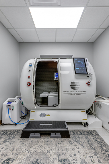 Hyperbaric oxygen therapy chamber for facial plastic surgery in a clinical room.