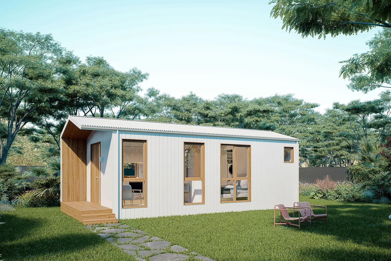 A small white building sitting on top of a lush green field.