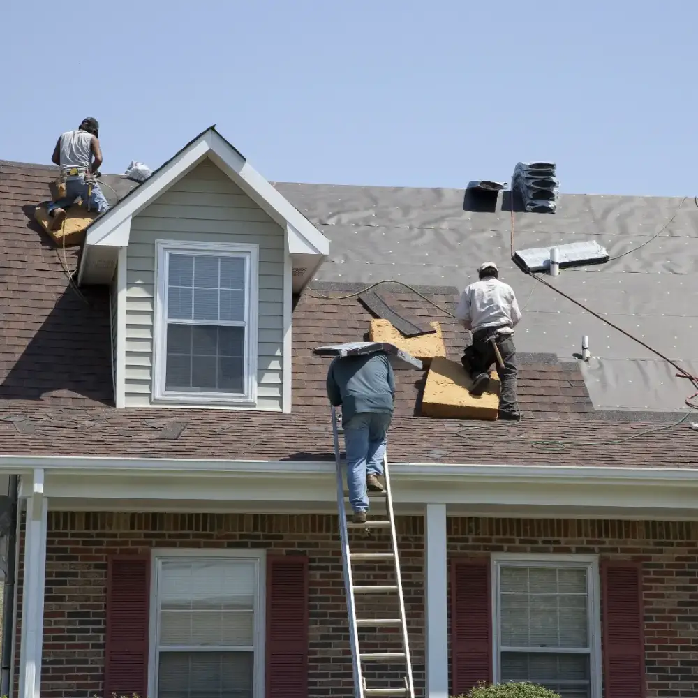 Professional roofing contractor working on residential roof installation by Viking Exteriors