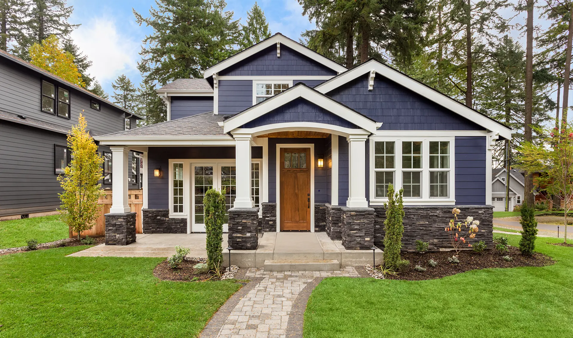 Modern home exterior with fresh roof and siding replacement showcasing quality exterior remodeling work