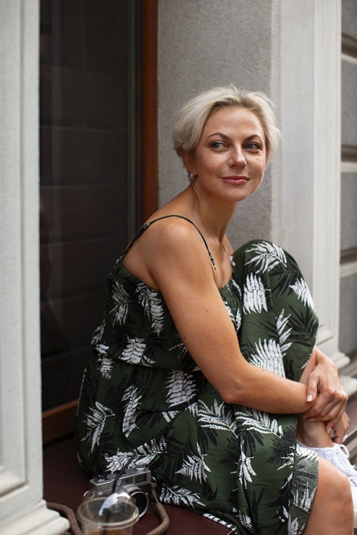 discreet health website image - a middle aged women feeling happy after treatment