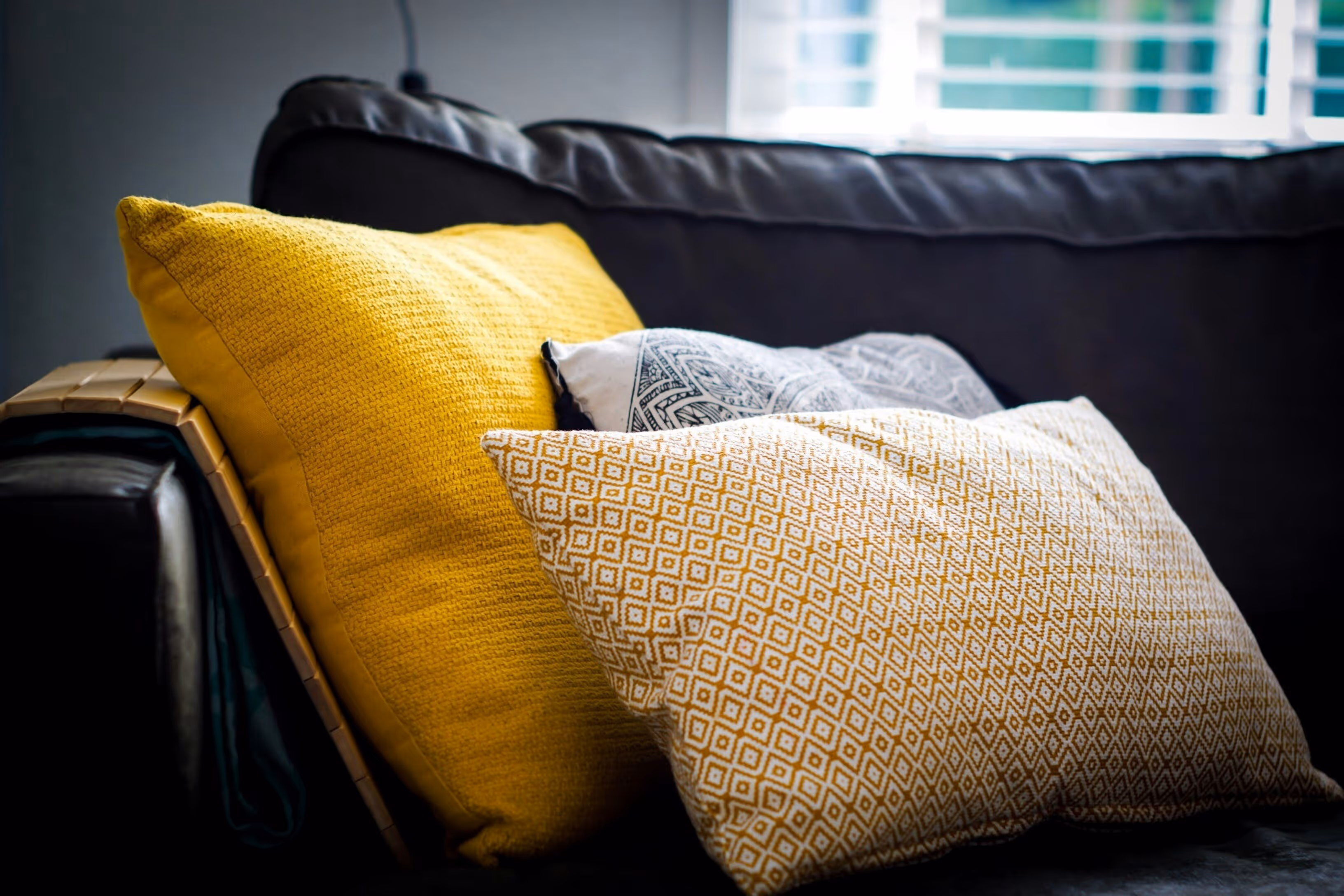 Couch with Yellow Pillow Stock Photo