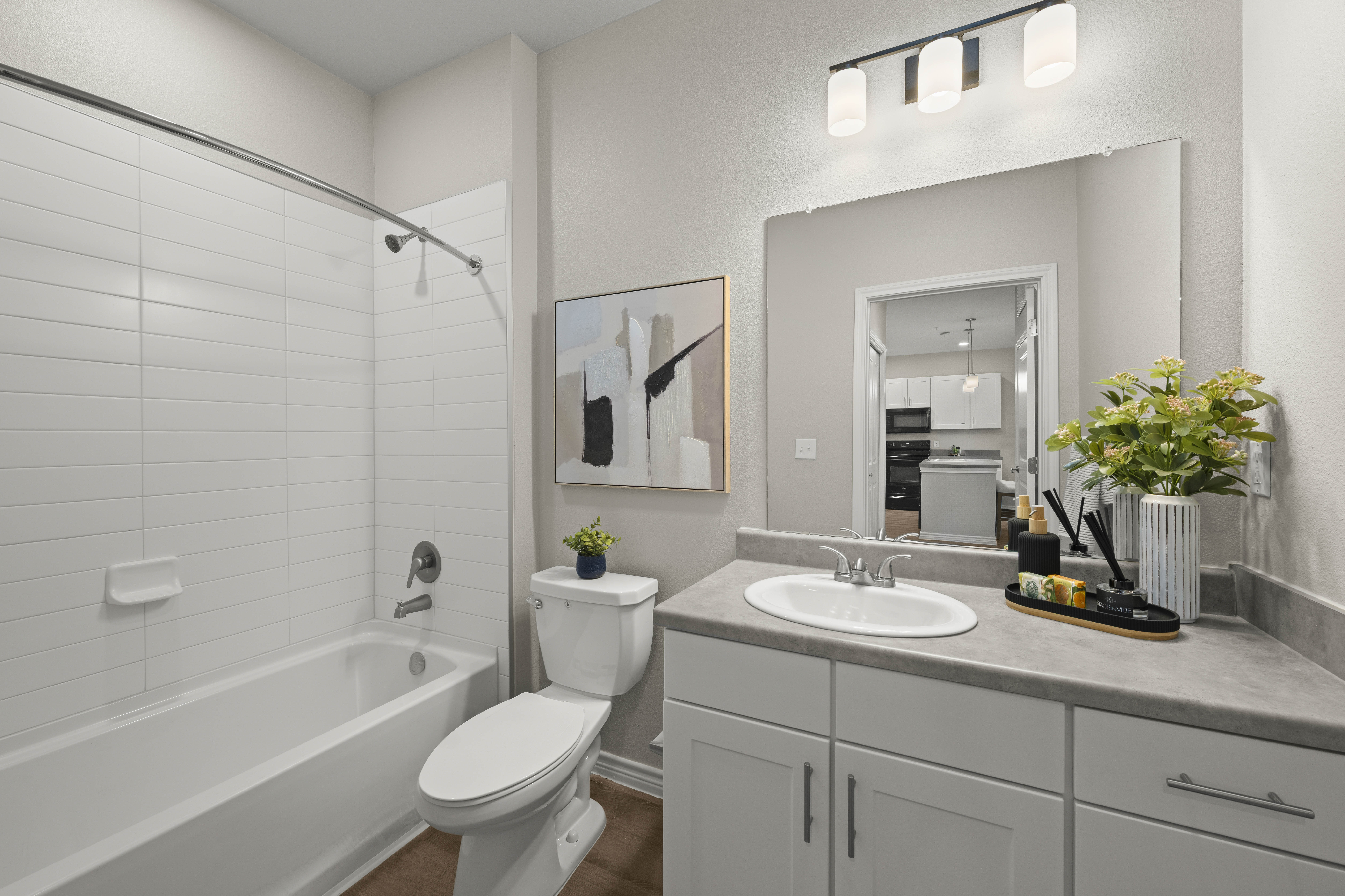 bathroom with white cabinets