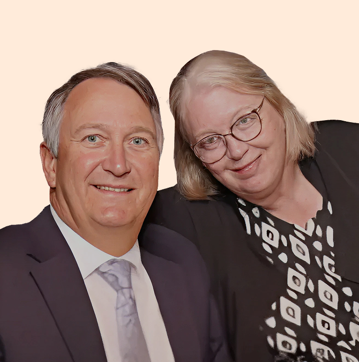 Wayne and Vickie smiling together in a portrait