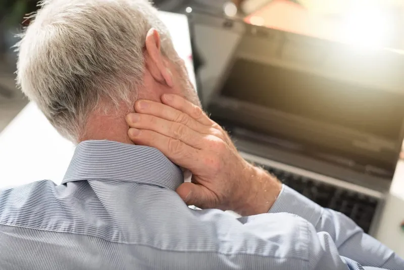 Older man experiencing neckpain