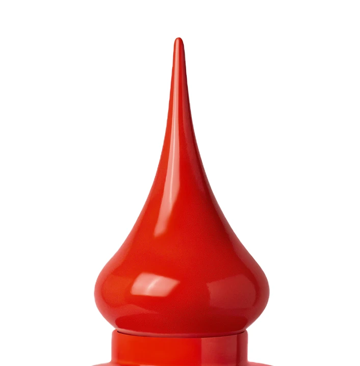 Close-up of a shiny red plastic nozzle tip on a container against a white background.