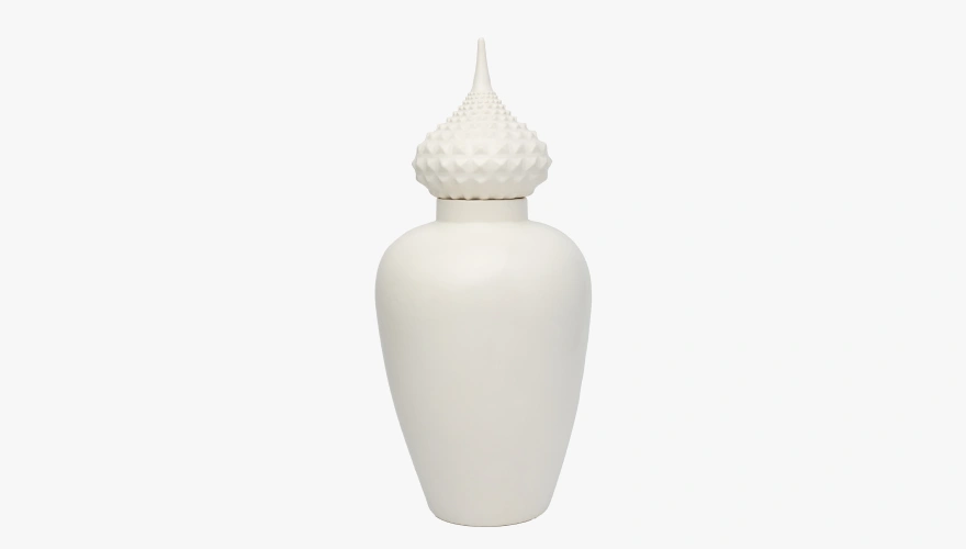 Tall white ceramic jar with a rounded body and a pointed lid featuring a textured, spiked pattern.