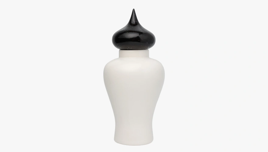 White ceramic jar with a curvy shape and a glossy black pointed lid.
