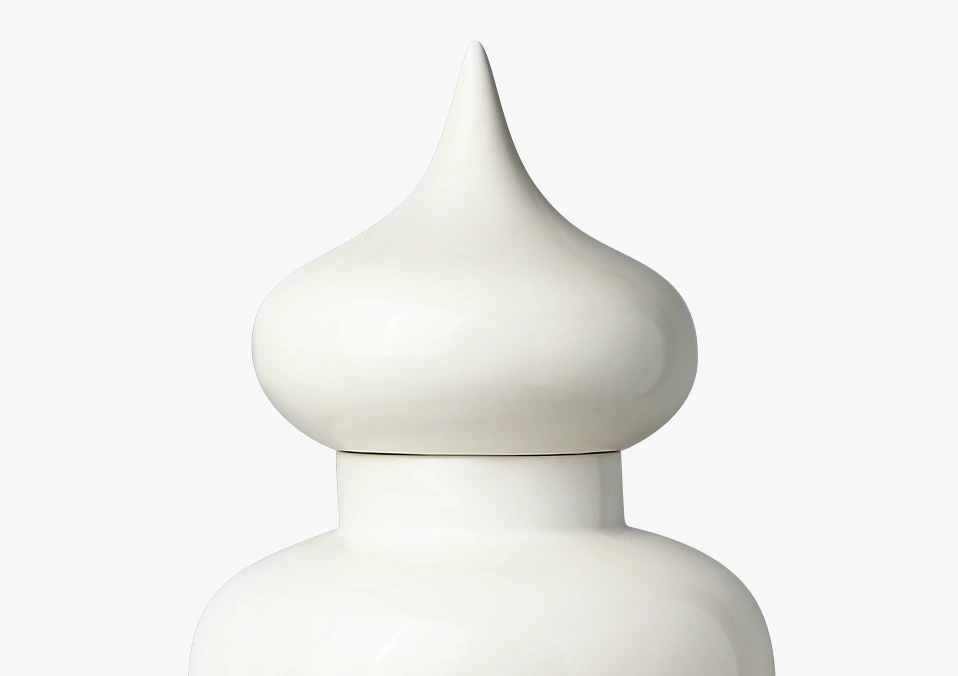 Glossy white ceramic jar with a bulbous, pointed lid resembling a droplet shape.