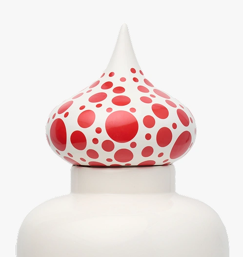 White sculpture with pointed top covered in red polka dots of varying sizes.