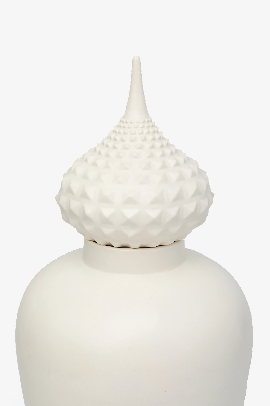 White ceramic jar with a textured, pointed lid featuring diamond-shaped patterns.