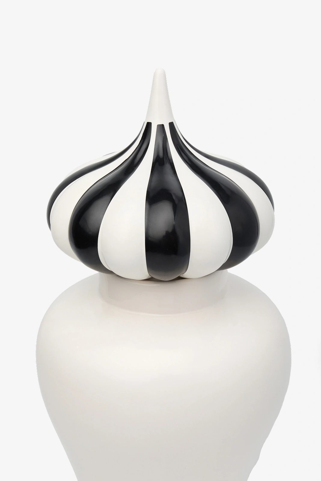 Ceramic vase with a glossy white base and a black-and-white striped, pointed top resembling a stylized garlic bulb.