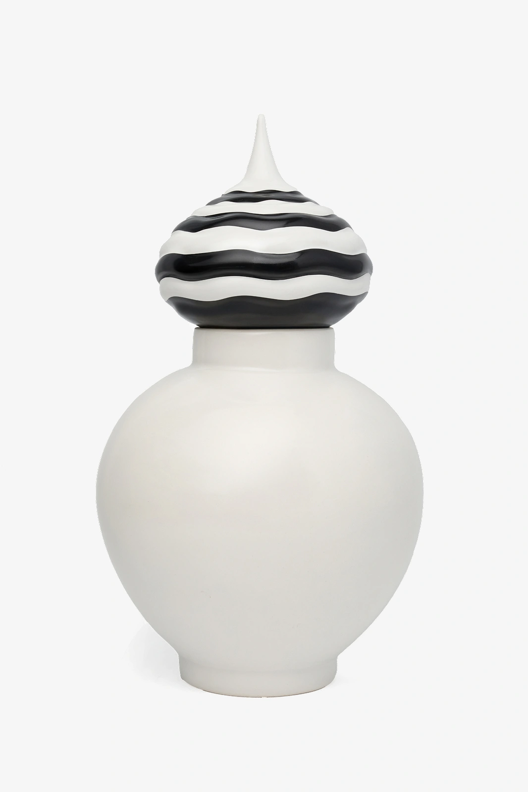 White ceramic jar with a black and white striped wavy-patterned lid topped with a pointed finial.