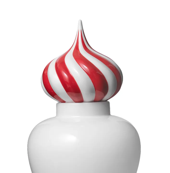 White container with a red and white swirled, pointed lid resembling a candy or festive design.