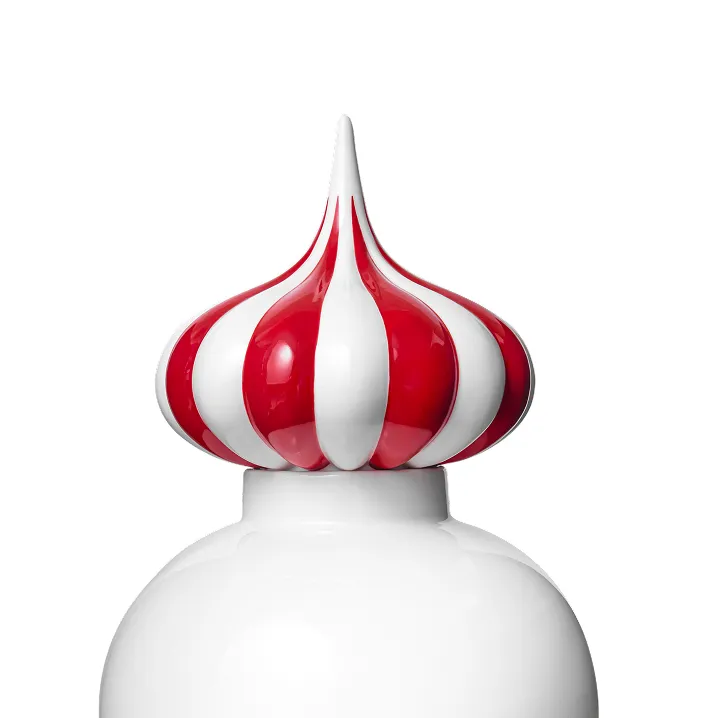 Red and white striped onion dome architectural structure on a white base against a white background.