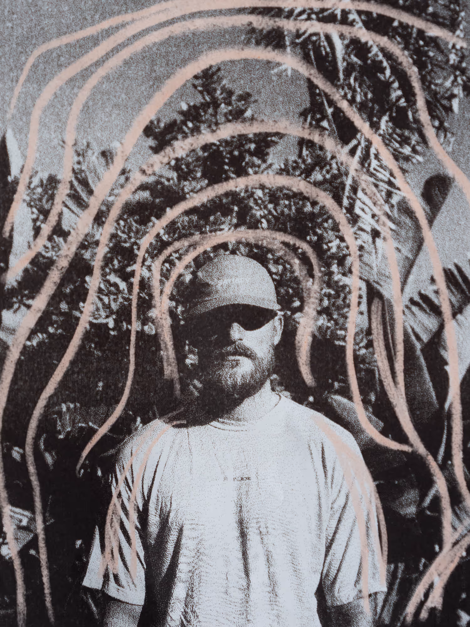 Black and white portrait of a man with pink doodles on top 