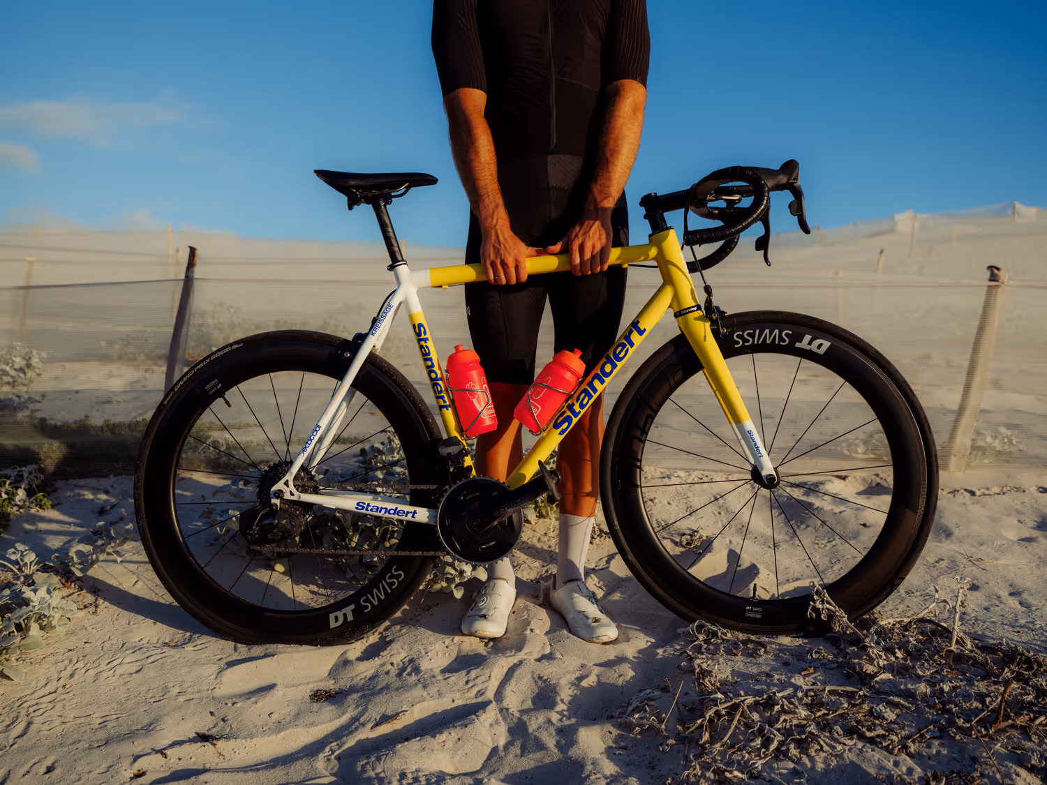 Image of a man posing with a bike