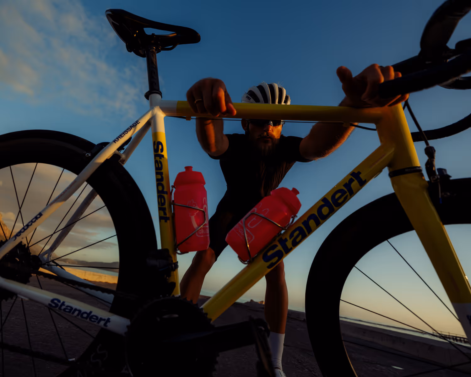 Image of a man holding his bike 