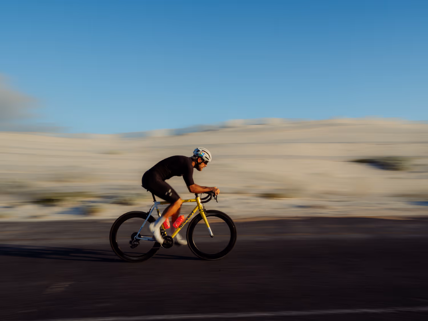 Action shot of a man cycling down the road 