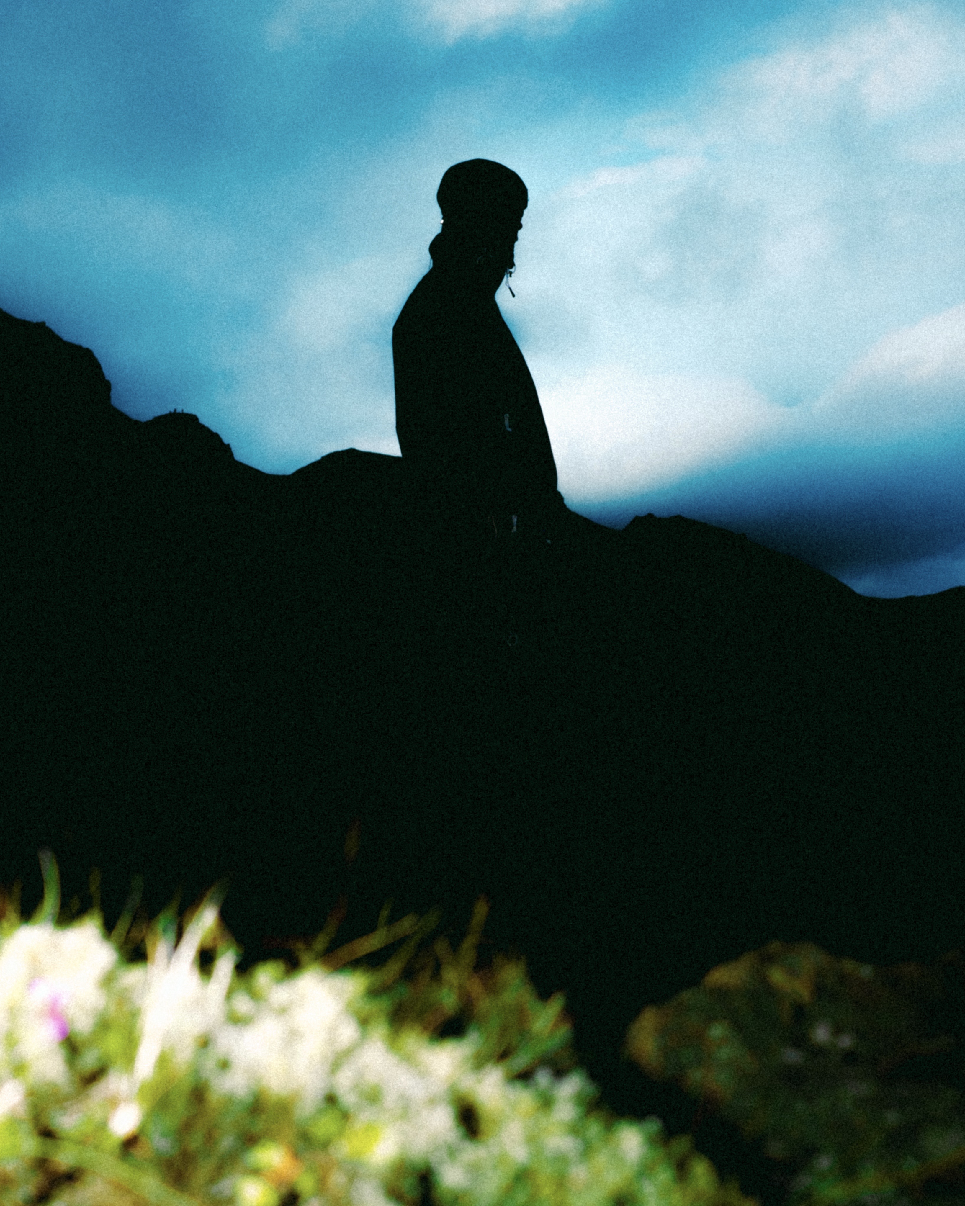Shadow of a male figure on a hill