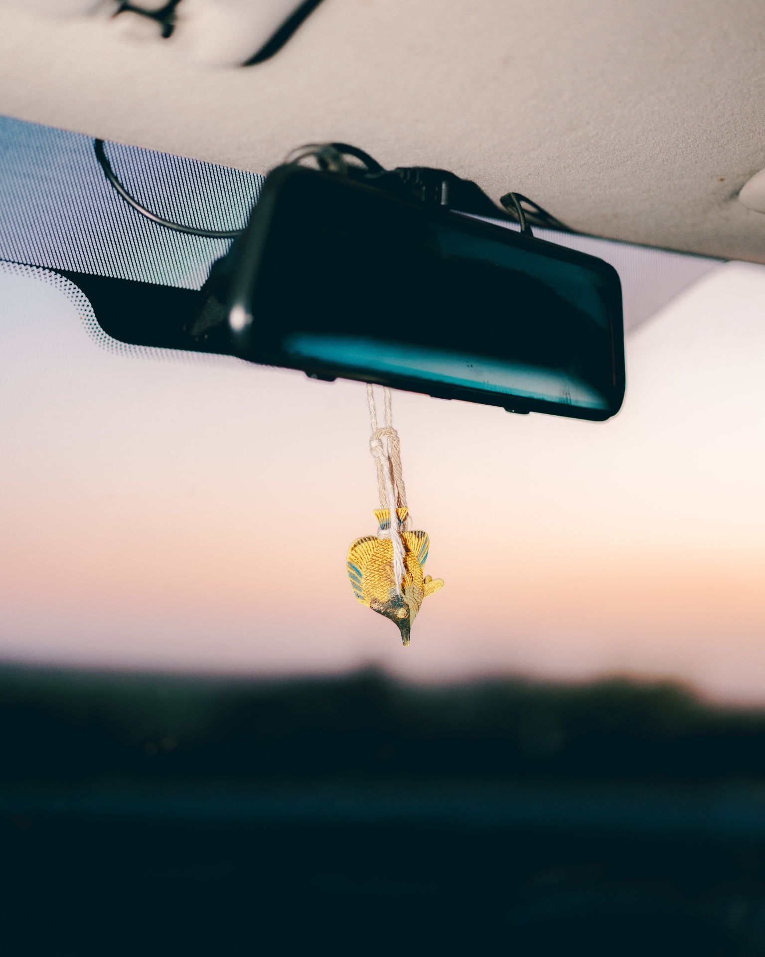 Keychain hanging from car mirror