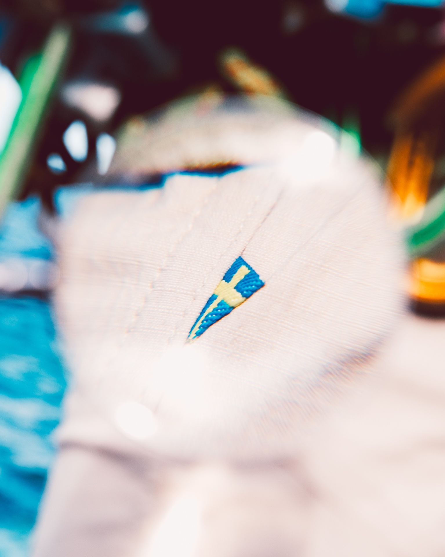 Up close image of swedish embroidered flag on clothing 