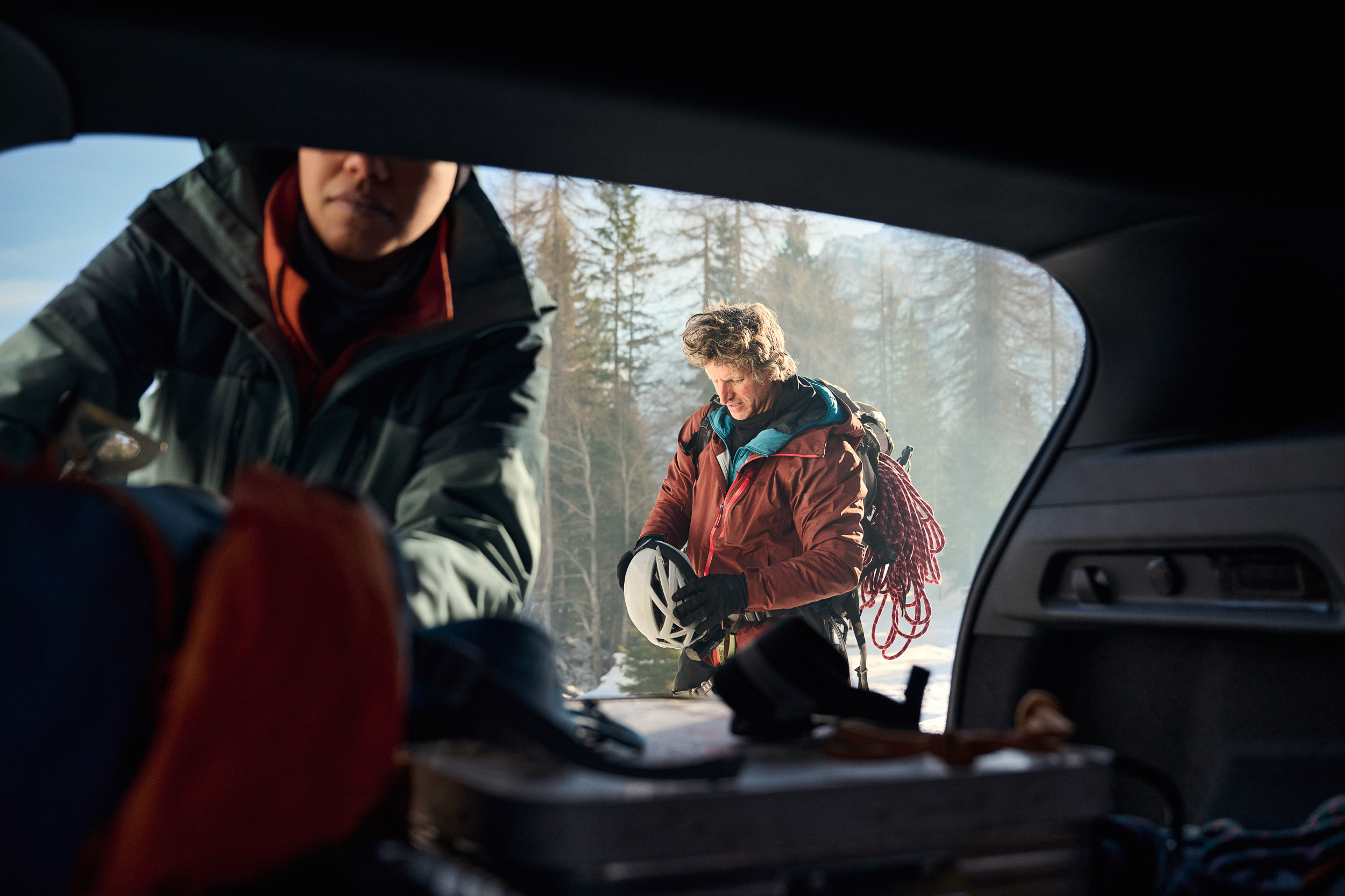Two people loading up car