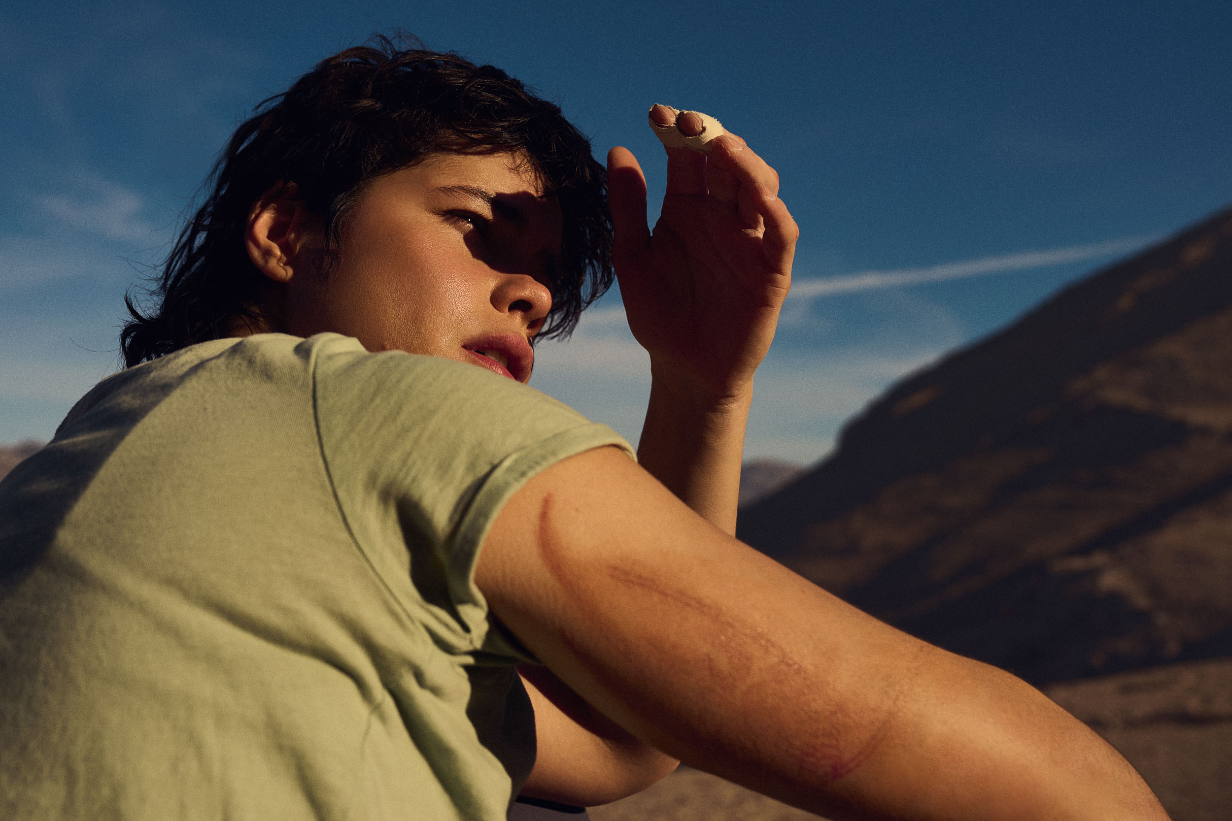 Woman shading eyes from sun