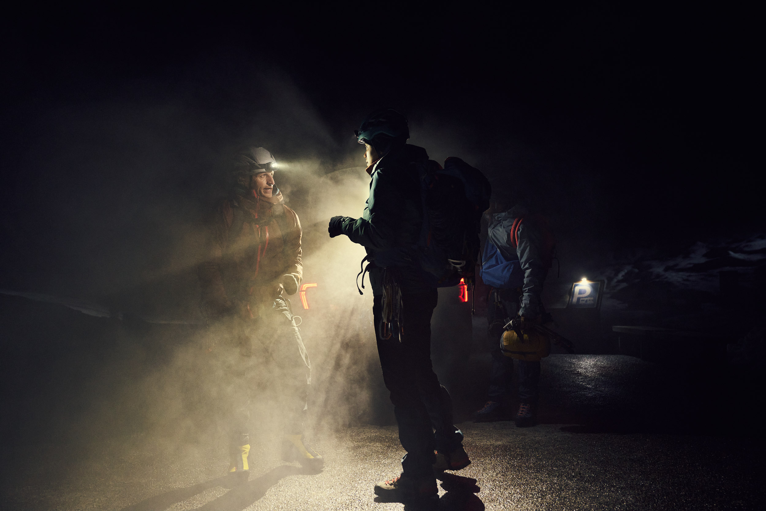Climbers with head torch on at night