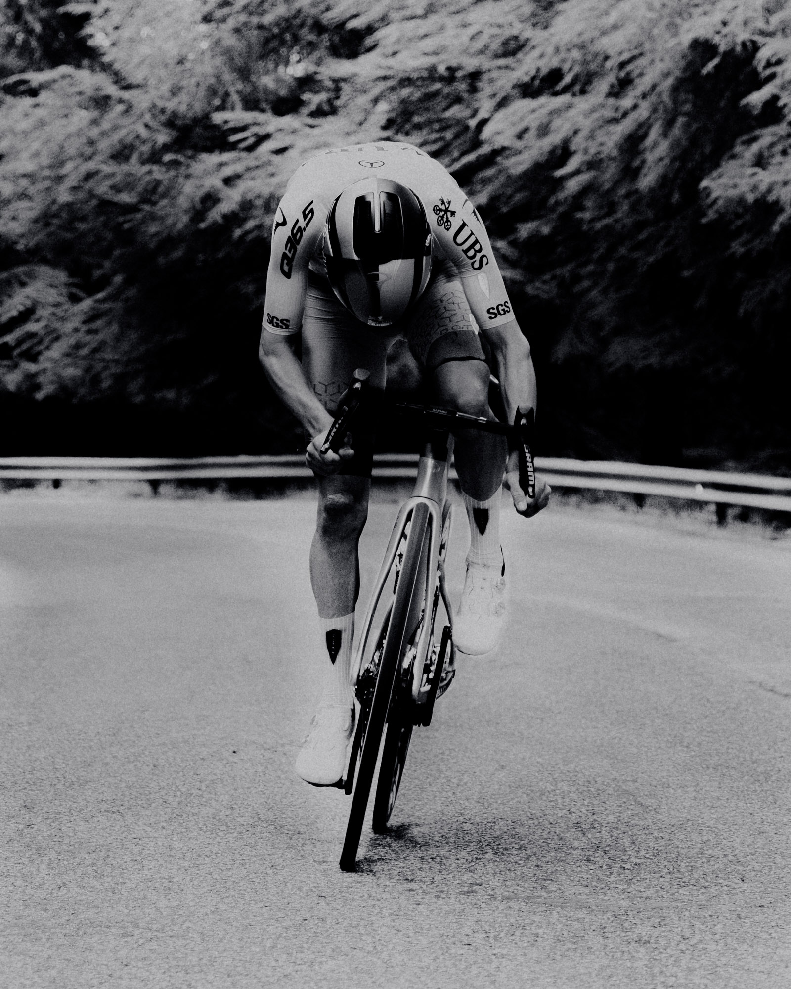 Man riding bike in black and white 
