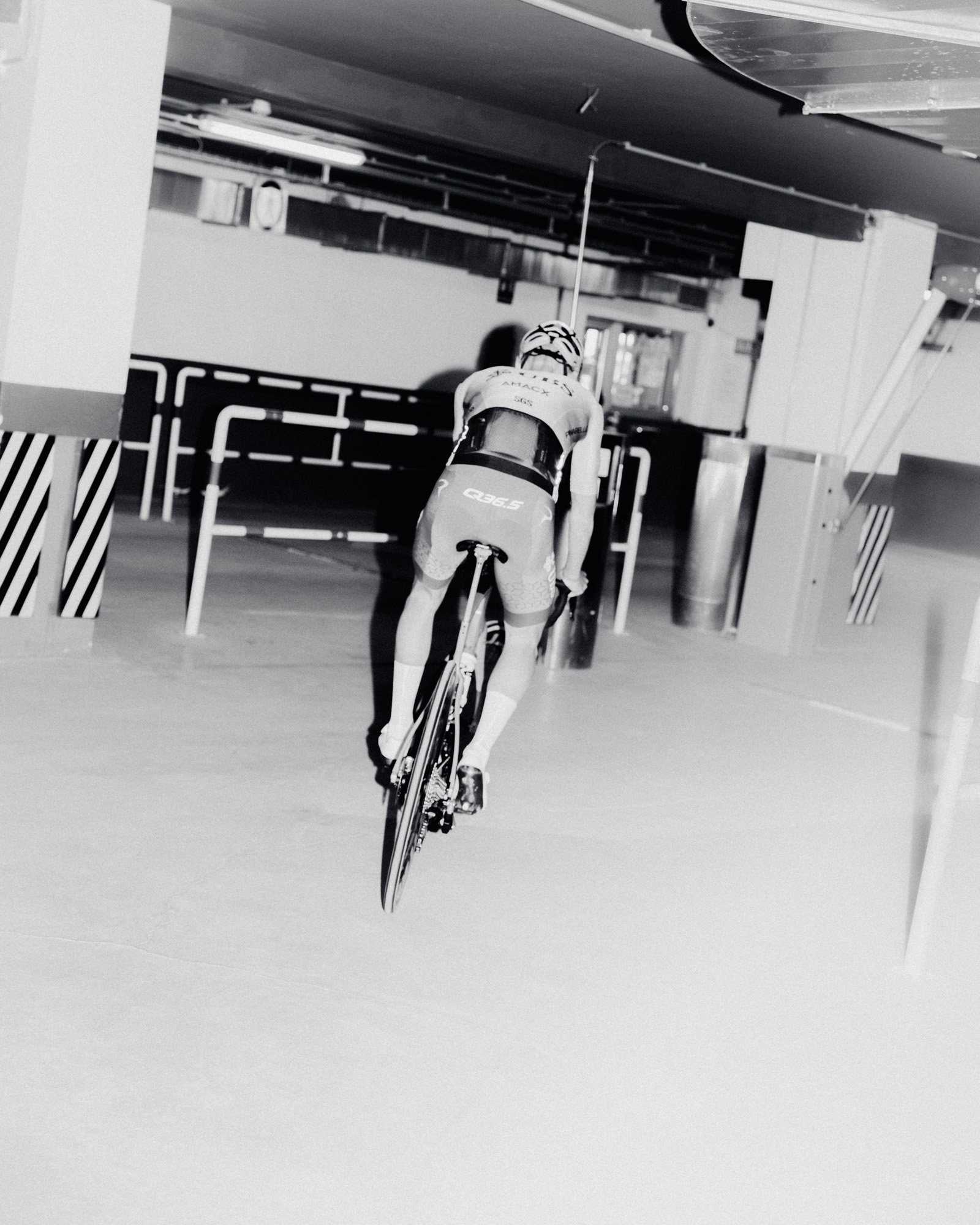 Man riding bike indoors