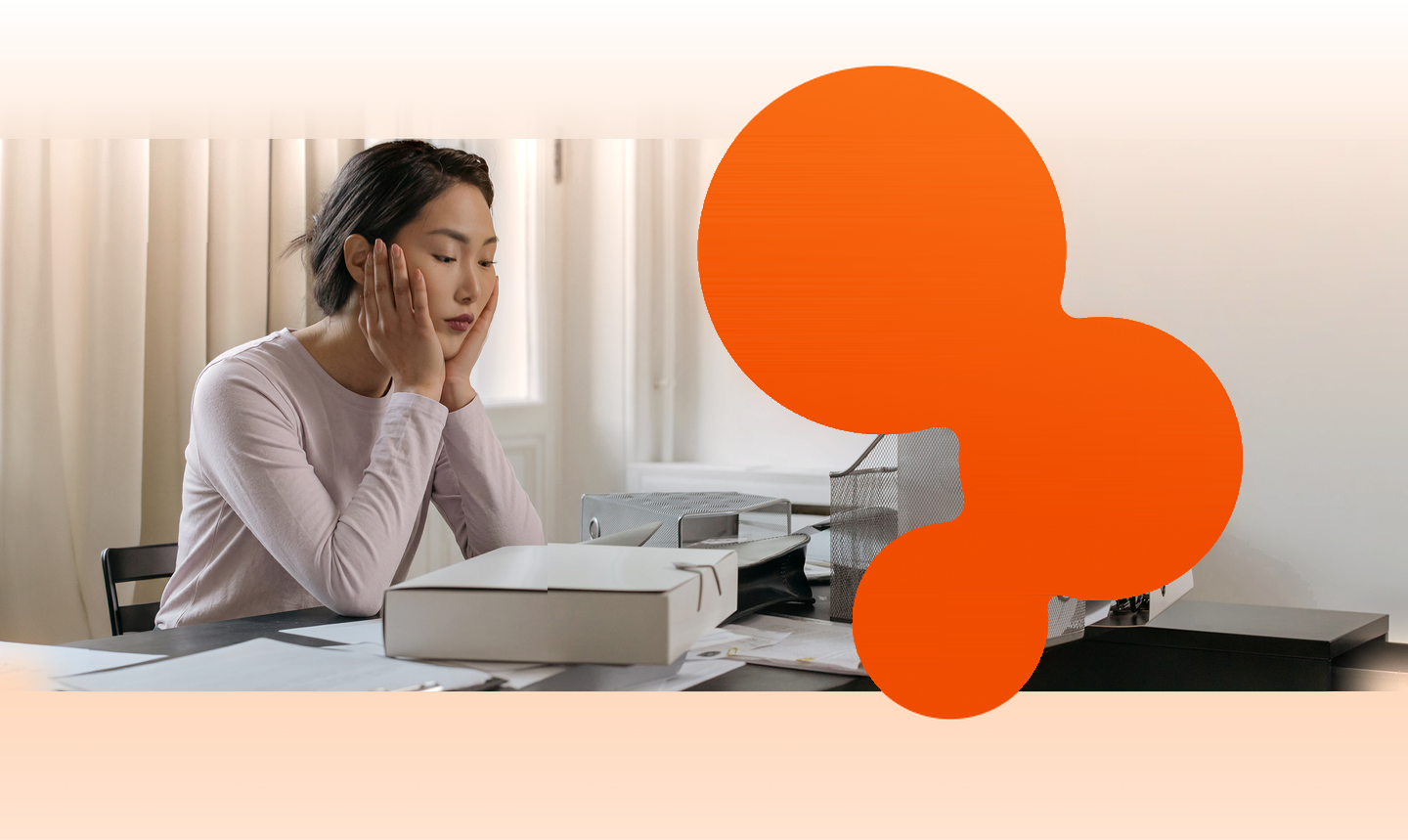 A renter at a desk surrounded by printed rental applications