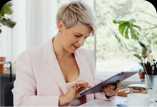 A landlord reviewing an application on a tablet