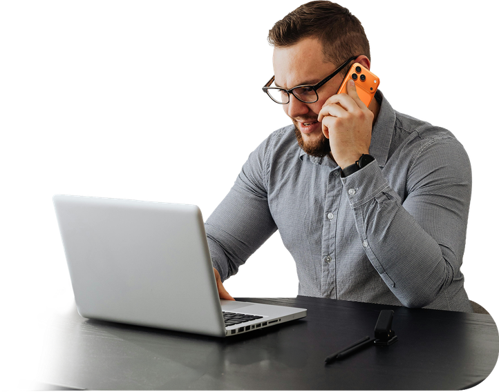 Landlord on the phone reviewing a consumer report at a laptop